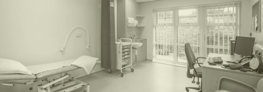 Empty GP consultation room in a UK primary care practice, highlighting the impact of missed appointments and how Vela Medical Group supports practices facing high DNA rates.