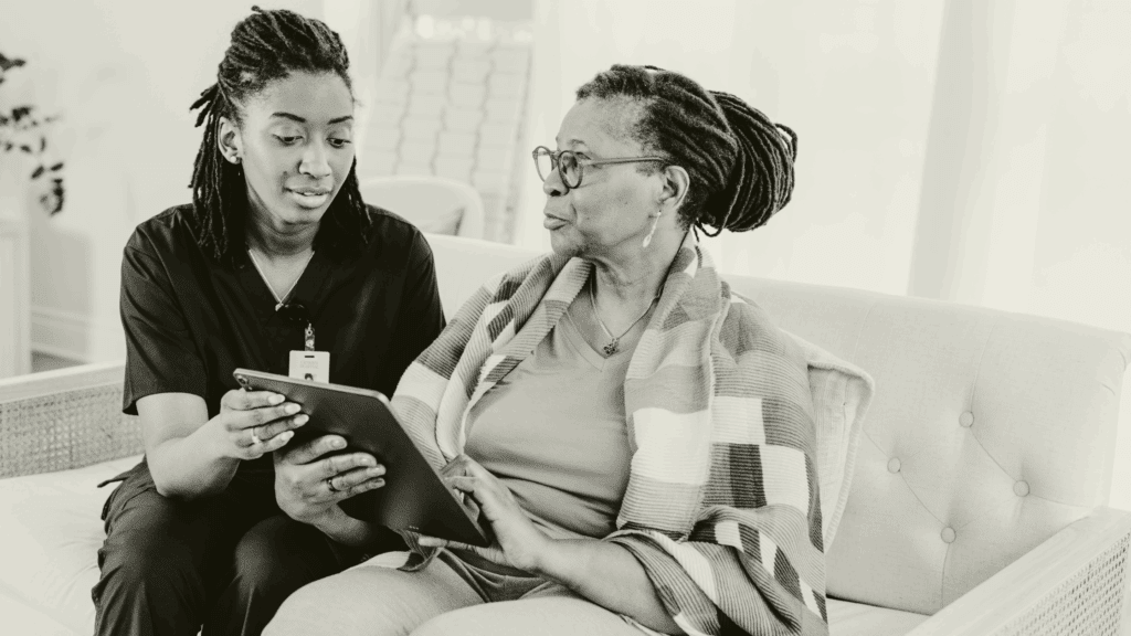 Primary care locum clinician supporting a patient during a consultation, demonstrating professionalism and patient-centred care.