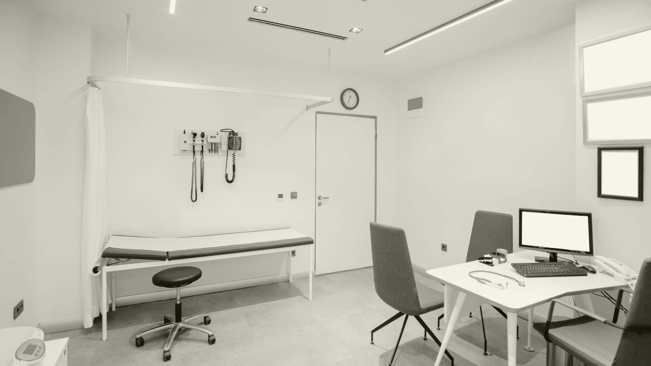 Modern GP consultation room prepared for locum clinician support in a UK primary care setting
