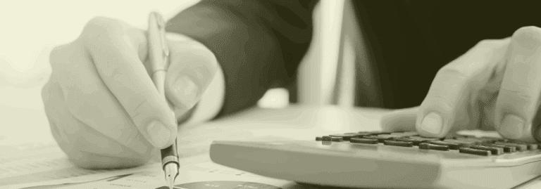 Person reviewing agency costs with a calculator and financial report