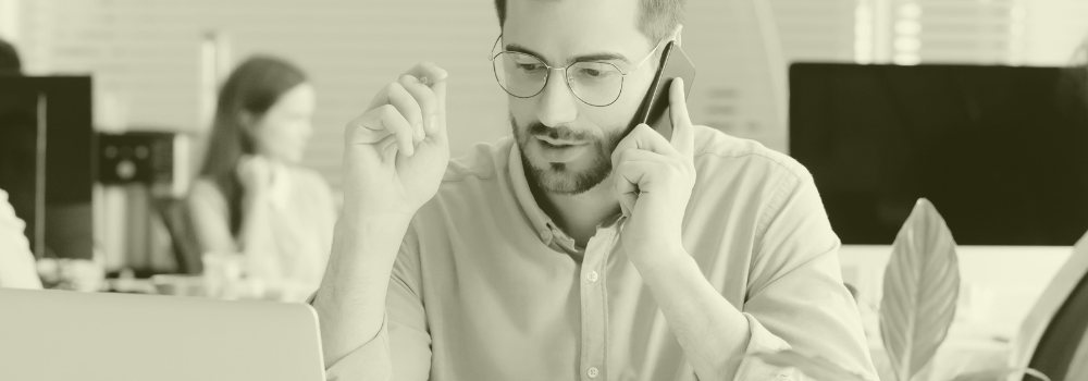 Primary Care recruiter on the phone discussing clinical staffing needs in a healthcare office