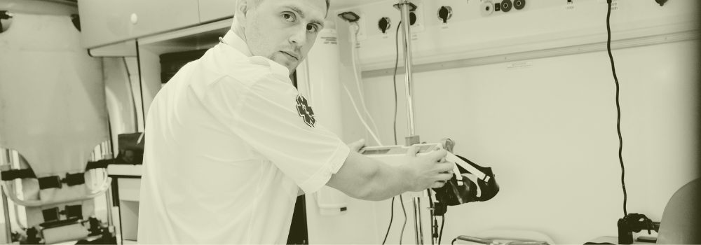 A Paramedic Practitioner organising medical equipment inside an ambulance, representing the transition of paramedics into primary care and their growing role in supporting GP services across the UK.