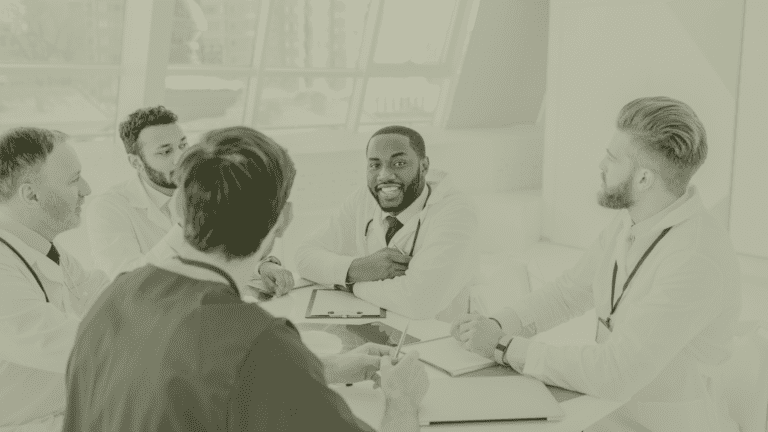 Primary Care clinicians in a PCN workforce planning meeting discussing ARRS roles, GP workload and multidisciplinary team structure in 2026