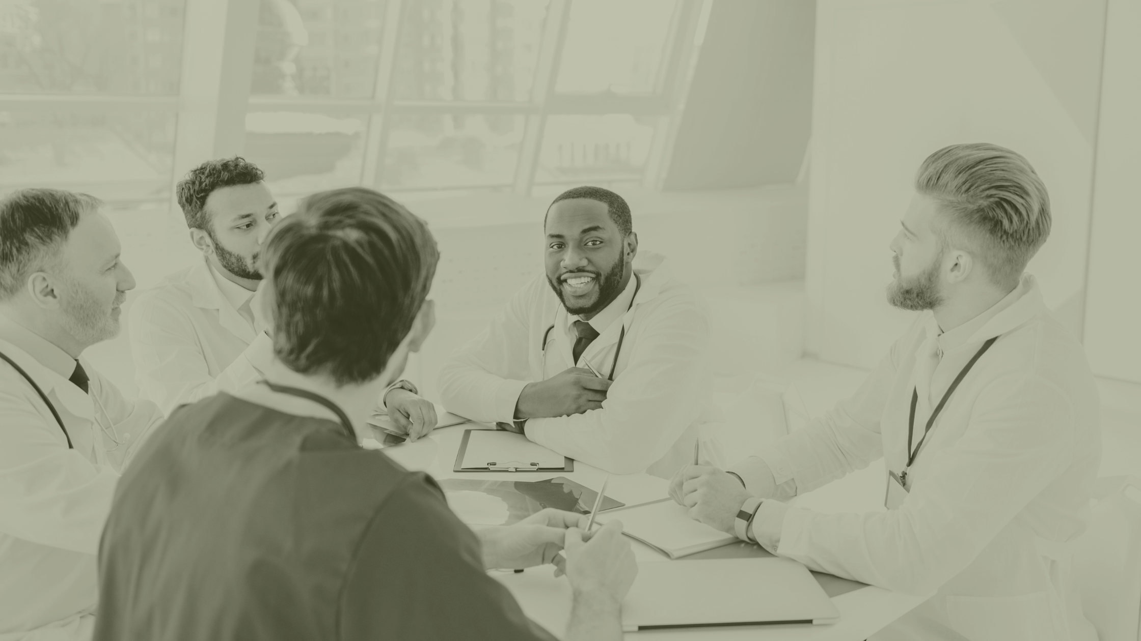 Primary Care clinicians in a PCN workforce planning meeting discussing ARRS roles, GP workload and multidisciplinary team structure in 2026